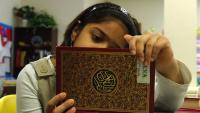 Girl reading the Koran